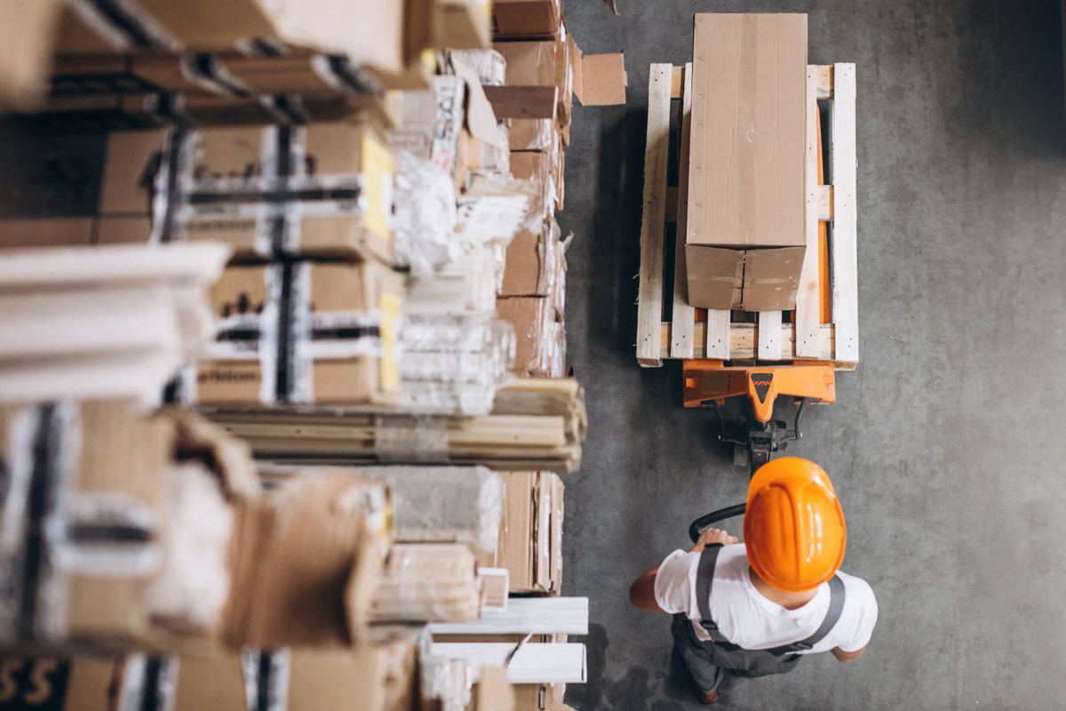 young man working warehouse with boxes